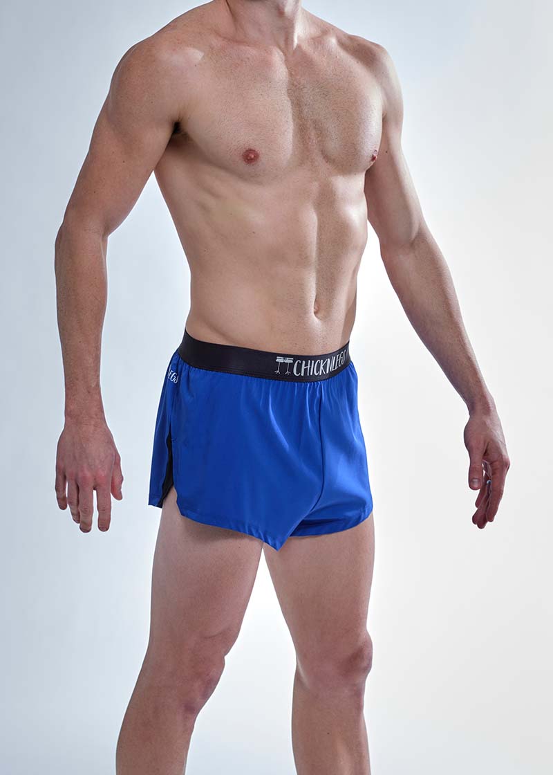 Side split closeup view of the chicknlegs men's 2 inch royal blue split running shorts.