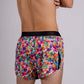 Rear view of the ChicknLegs men's tie-dye 2 inch split running shorts.