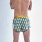 Rear view of the chicknlegs men's trippy pineapples 2 inch split running shorts.