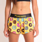 ChicknLegs women's donuts 1.5" split running shorts front view closeup.