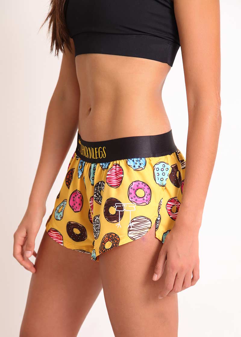 ChicknLegs women's donuts 1.5" split running shorts side view with logo.