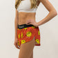 Left side logo view of the women's smiley face running shorts from ChicknLegs.