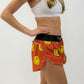 Side view of the women's smiley face running shorts from ChicknLegs.