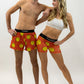 Group photo of the men's and women's smiley face running shorts from ChicknLegs.