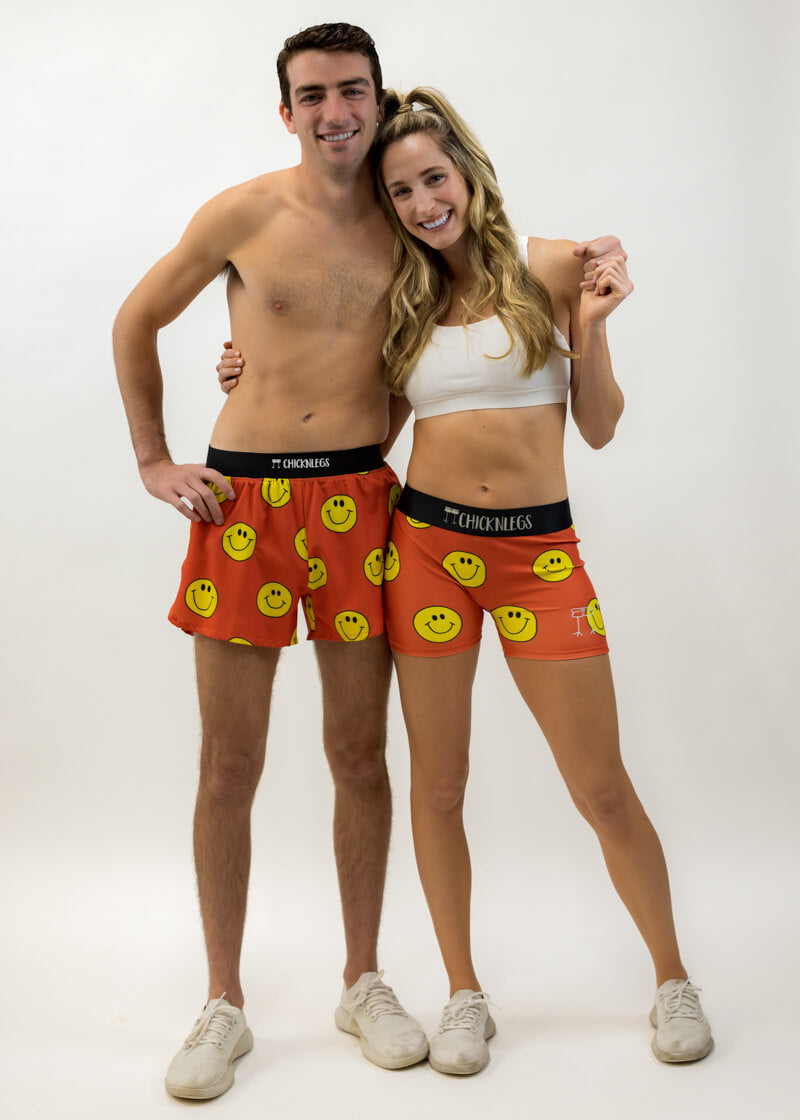 Group photo of the men's and women's smiley face running shorts.