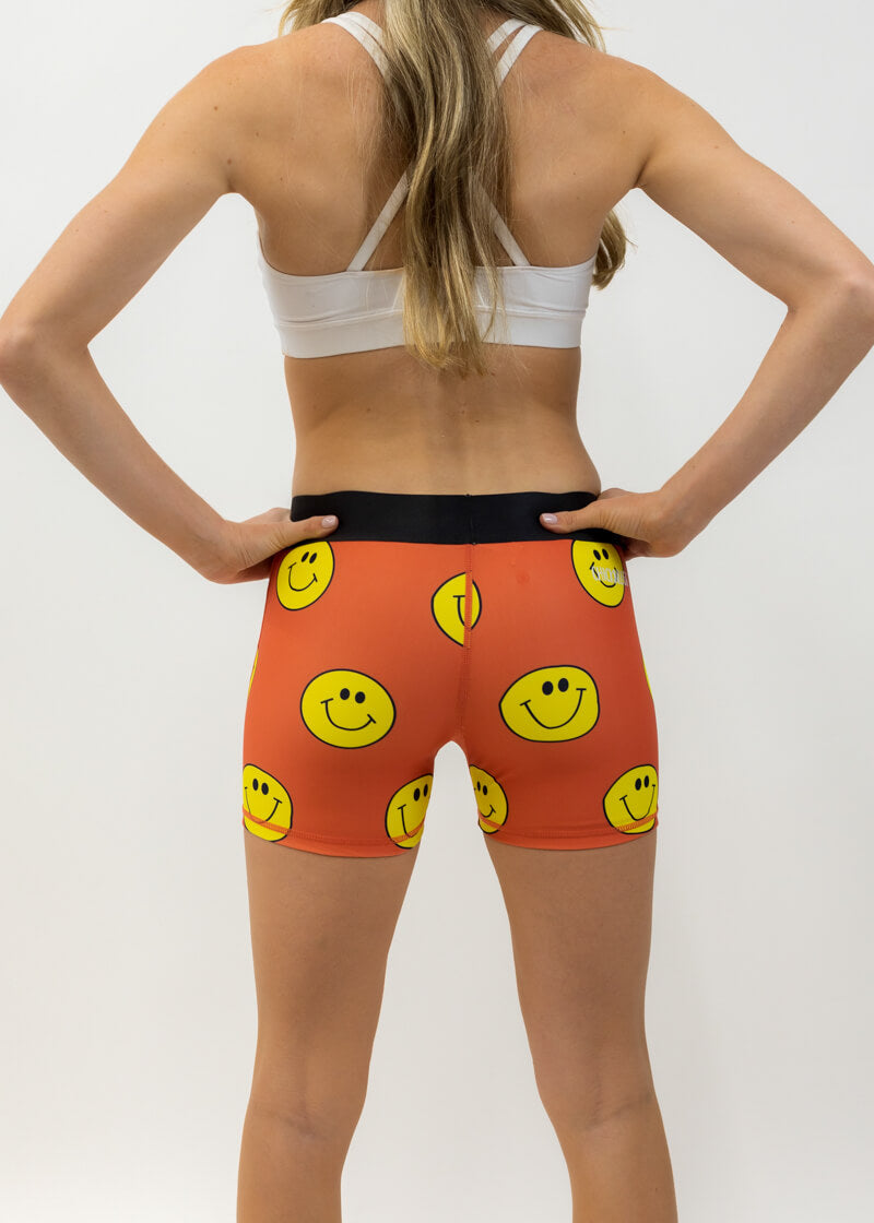 Back view of the women's smiley face 3 inch compression running shorts from ChicknLegs.