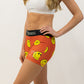 Left side logo view of the women's smiley face 3 inch compression running shorts from ChicknLegs.