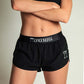 ChicknLegs women's black 1.5" split running shorts front closeup view.