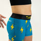 Side view of the women's blue bolts 3 inch compression running shorts.