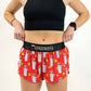 Front view of the women's 1.5 inch burritos split running shorts from ChicknLegs.