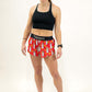 Full body shot of runner wearing the women's 1.5 inch burritos split running shorts from ChicknLegs.