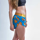 Side split view of the chicknlegs women's 1.5" split running shorts.