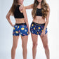 Full body group photo of the ChicknLegs Crypto compression and split running shorts.