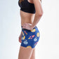 Left side view of the ChicknLegs women's crypto 3 inch compression running shorts.