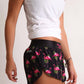 ChicknLegs women's flamingo 1.5" split running shorts.