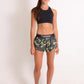 ChicknLegs women's green camo 1.5" split running shorts full body view.