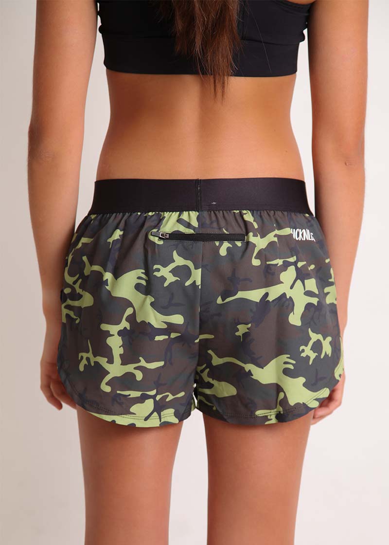 ChicknLegs women's green camo 1.5" split running shorts rear view including our zipper pocket to stash the essentials.