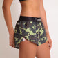 ChicknLegs women's green camo 1.5" split running shorts side view.