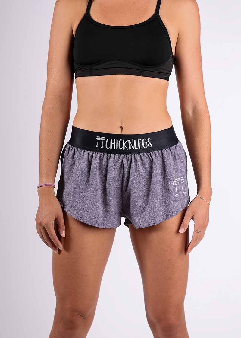 Front closeup view of the ChicknLegs women's 1.5" heather grey split running shorts.