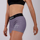 Logo side closeup view of the ChicknLegs women's heather grey 3 inch compression shorts.