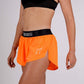 Left side view of the women's 1.5 inch neon orange split running shorts.