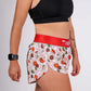 ChicknLegs women's 1.5" pasta night split running shorts side closeup view.