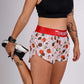 ChicknLegs women's 1.5" pasta night split running shorts front stretching view.