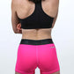Back view of the women's neon pink 3 inch compression running shorts.
