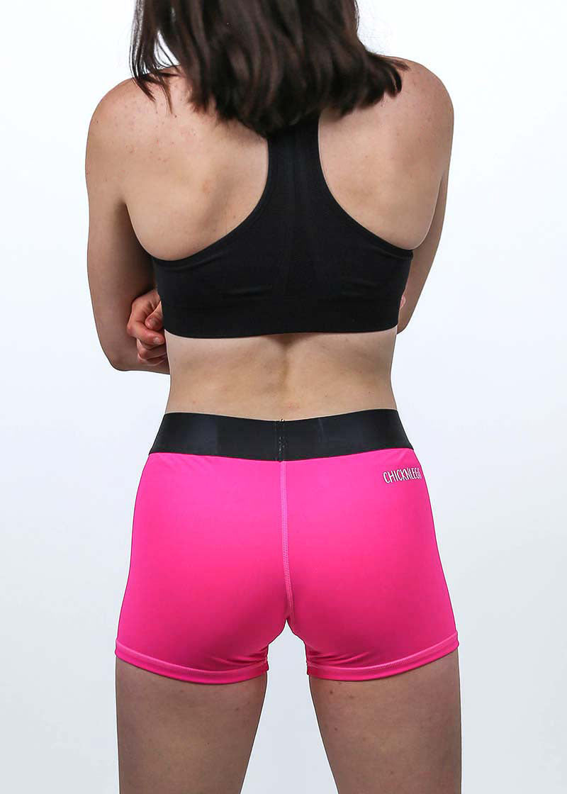Back view of the women's neon pink 3 inch compression running shorts.