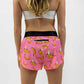 Rear view of the women's pink bananas split running shorts from ChicknLegs.