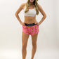 Full body shot of the women's pink bananas running shorts from ChicknLegs.