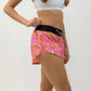 Side closeup view of the women's pink bananas split running shorts from ChicknLegs.