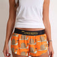ChicknLegs women's snail's pace 1.5" split running shorts front view with white tank top.