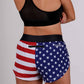 Rear view of the ChicknLegs women's USA split running shorts.
