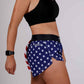 Side closeup view of the ChicknLegs women's USA split running shorts.