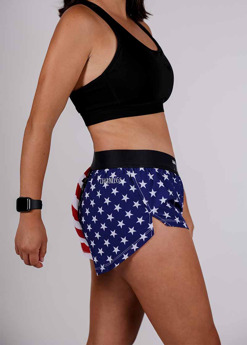 Side closeup view of the ChicknLegs women's USA split running shorts.