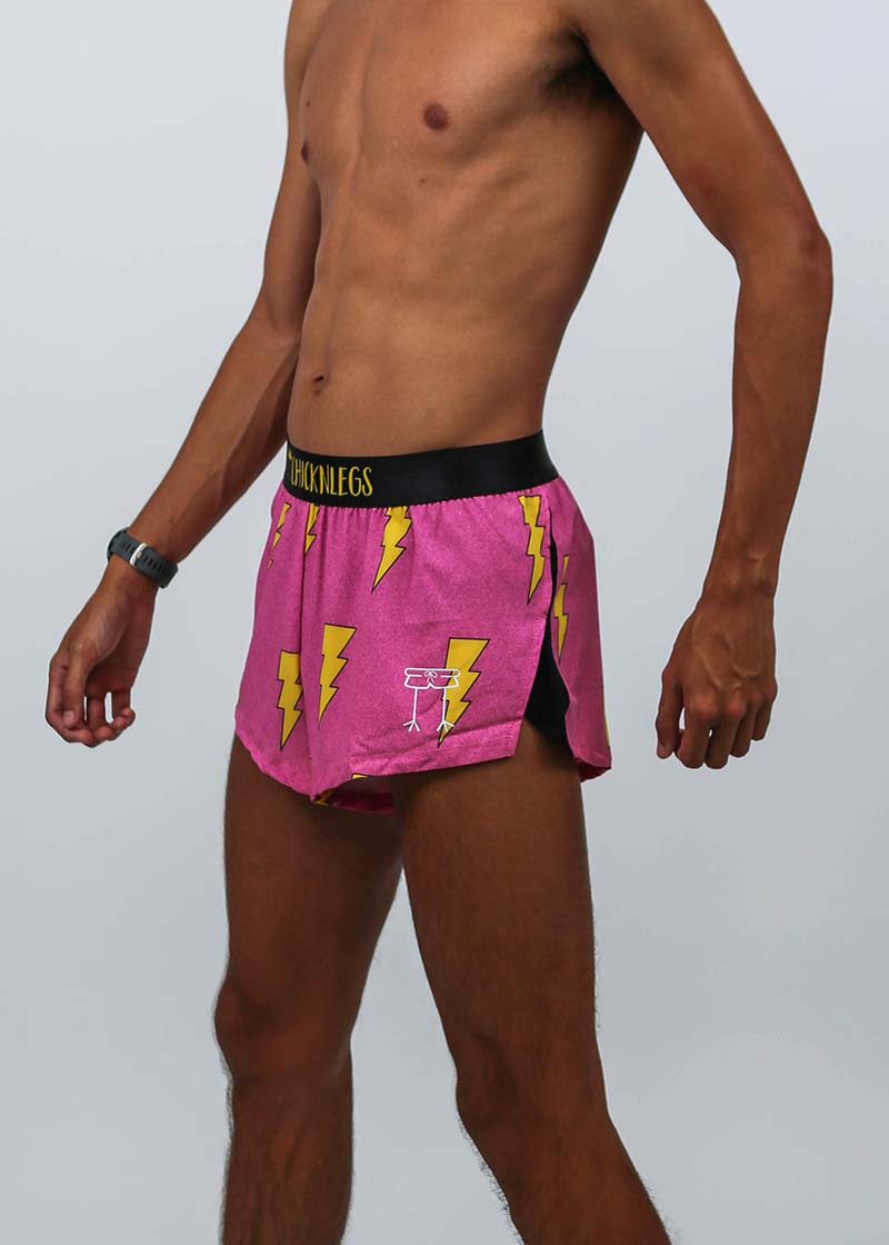 Left side closeup view of the men's 2 inch hot pink bolts running shorts.