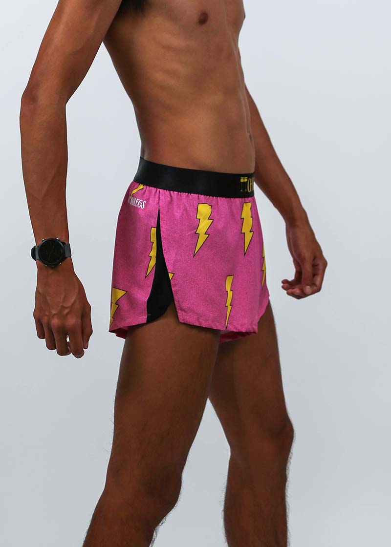 Right side closeup view of the men's 2 inch hot pink bolts running shorts.
