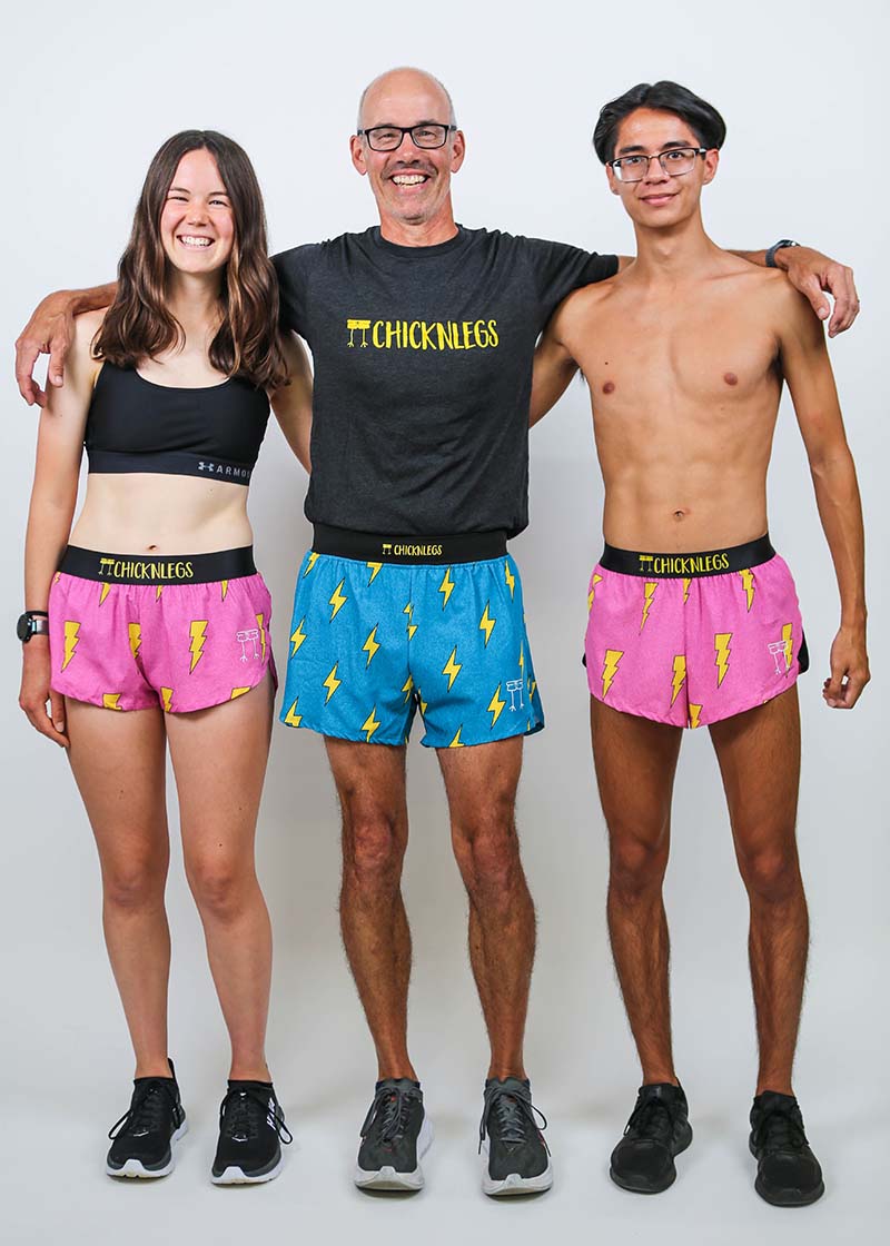 Group photo of the men's and women's pink bolts and blue bolts running shorts.