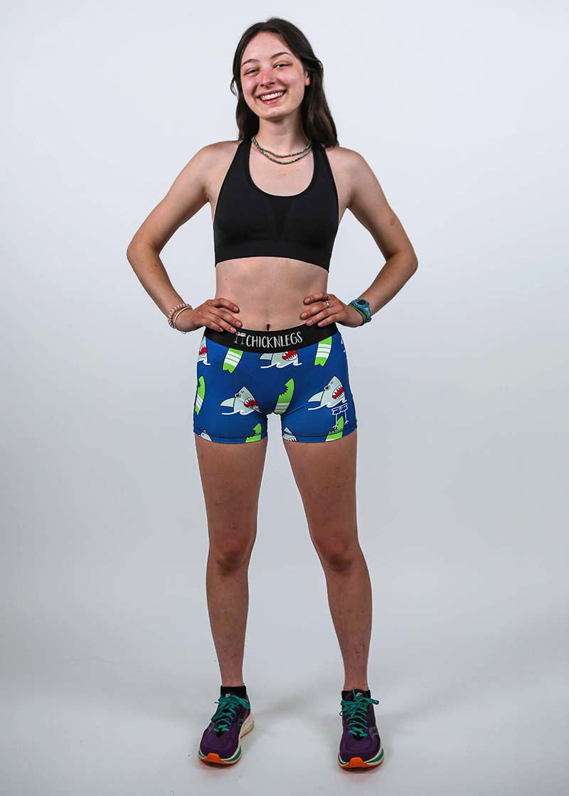 Full body view of the women's 3 inch blue sharks compression running shorts.